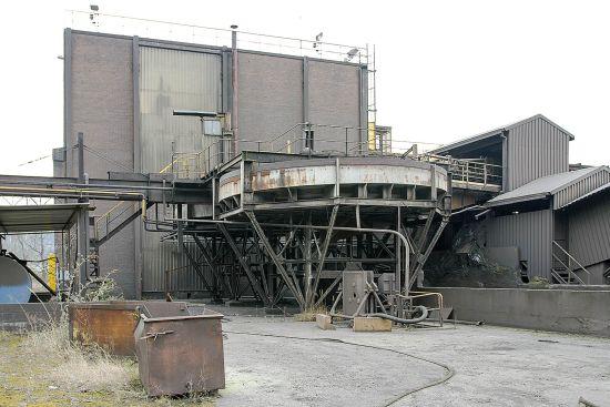 Factory building with stairs, pipes and an elevated walkway